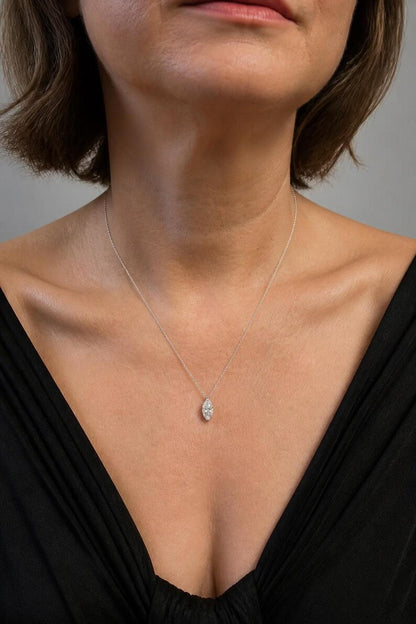 Marquise pendant necklace with black V-neck top