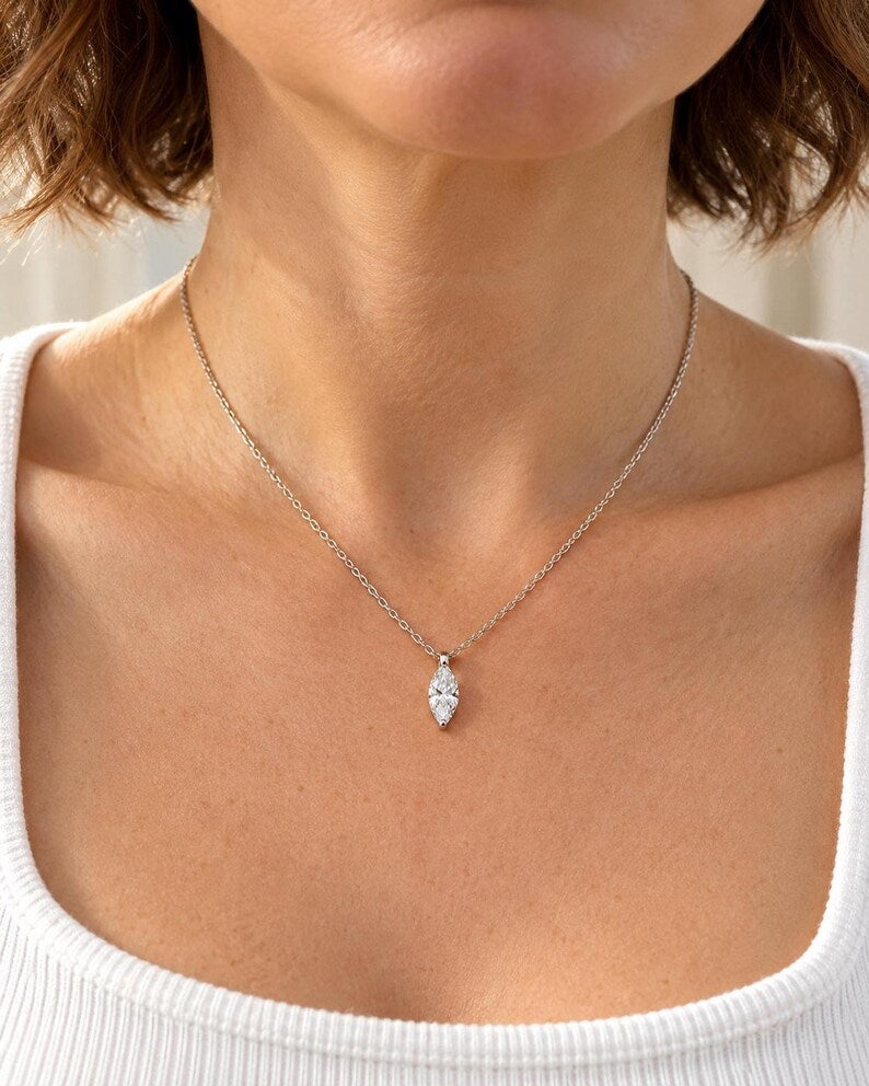 Marquise moissanite necklace worn with white ribbed top