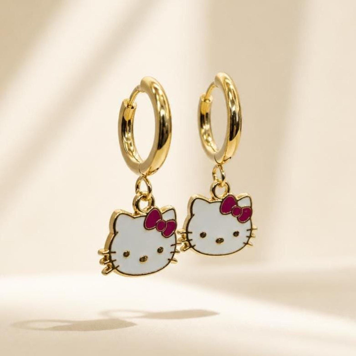 Kawaii cat gold huggie earrings with a lavender bow charm, 18k gold-plated stainless steel